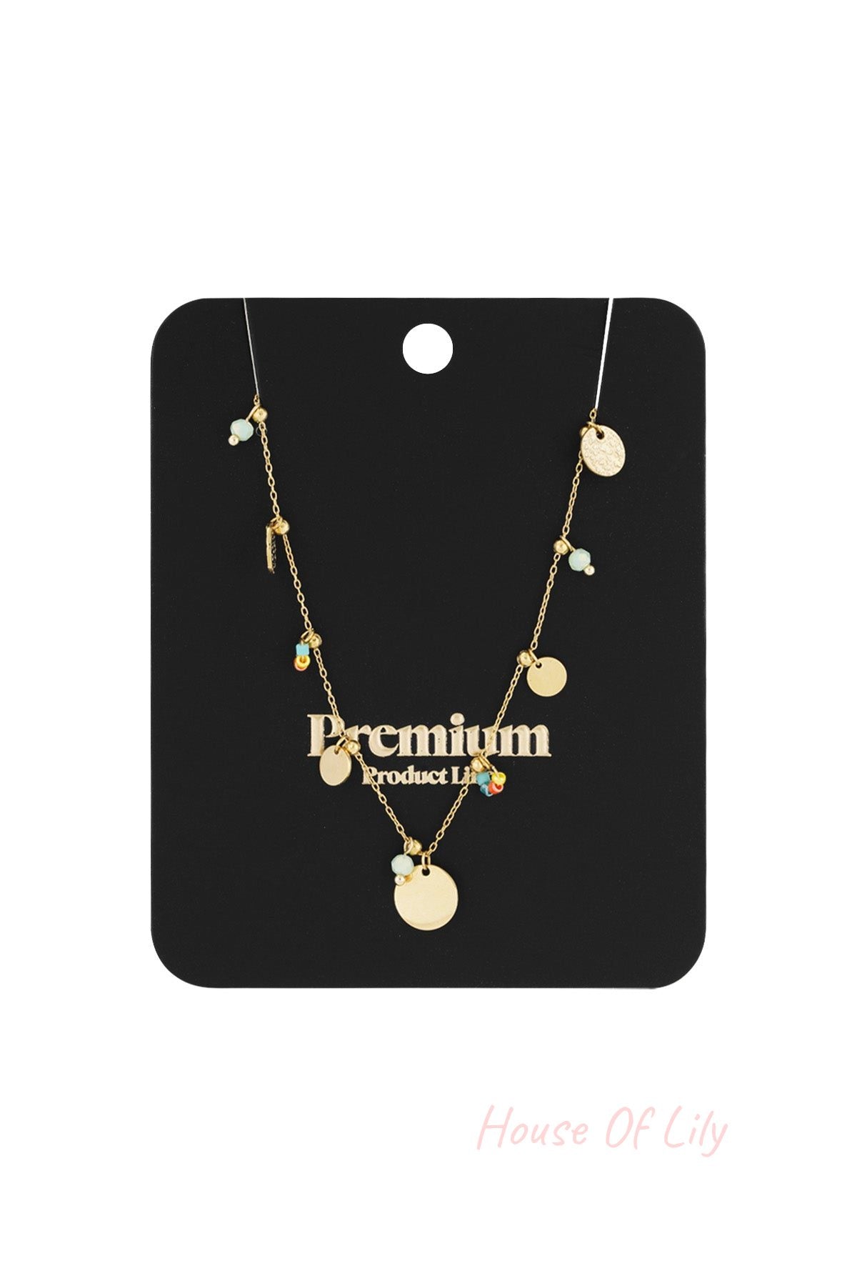 Gold disc charm necklace displayed on black premium product card with gold discs and colourful bead details