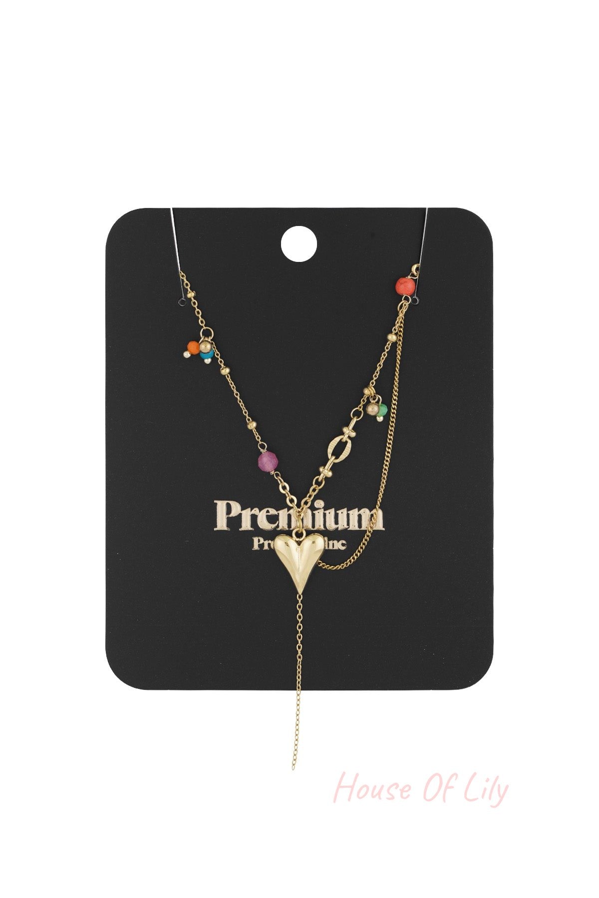 Gold heart pendant necklace displayed on black card with colourful bead accents and hanging chain detail