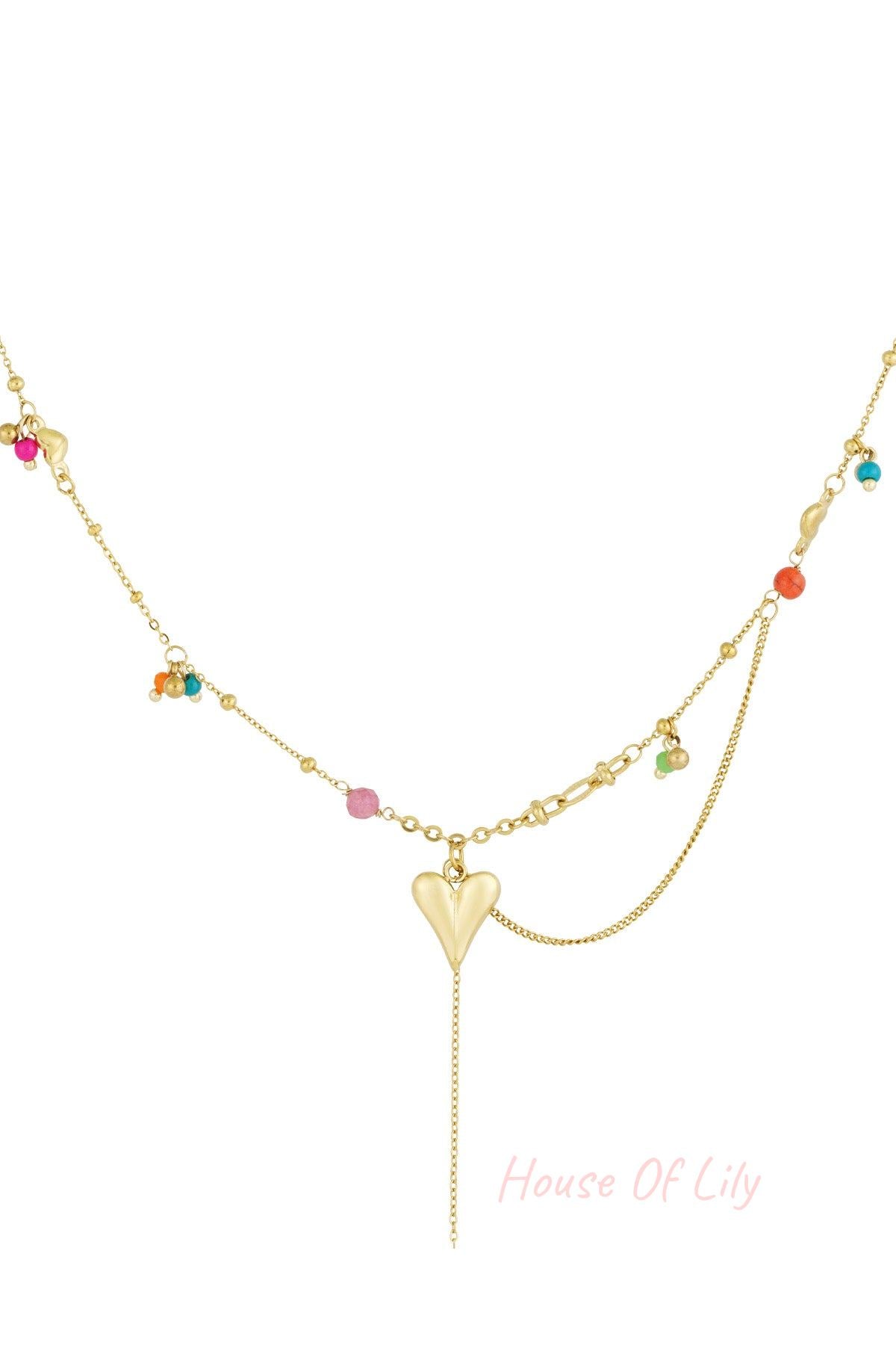 Gold pendant necklace with heart charm and colourful beads on gold chains, isolated on white background