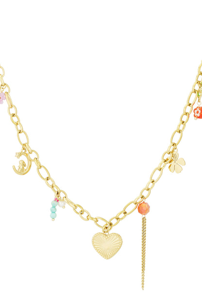 Gold chain charm necklace with heart pendant, clover, crescent moon charm, and colourful bead accents on white background