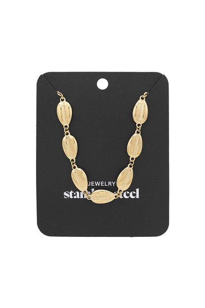 Shell link gold chain necklace displayed neatly on a black jewelry card