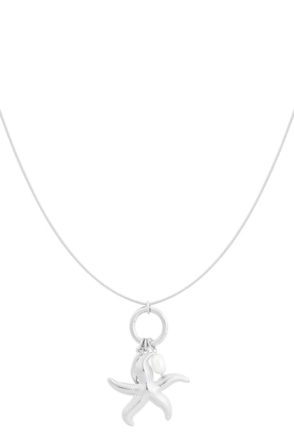 Silver starfish charm pendant necklace with pearl accent on a delicate chain against a white background