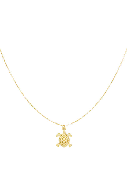 Gold turtle charm pendant necklace on a fine chain displayed on white background