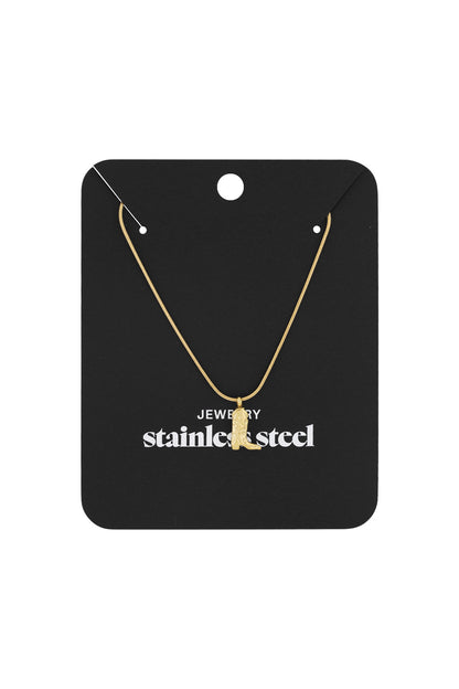 Gold cowboy boot pendant necklace displayed on black packaging labelled stainless steel jewelry
