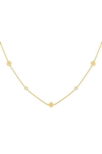 Gold-tone delicate chain necklace with spaced four-leaf clover charms and rhinestones on a white background
