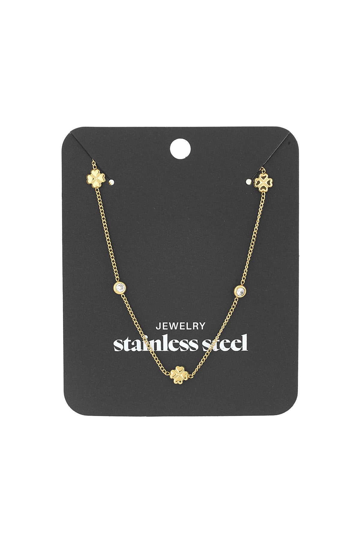 Gold-tone clover chain necklace attached to a black display card labeled stainless steel jewelry