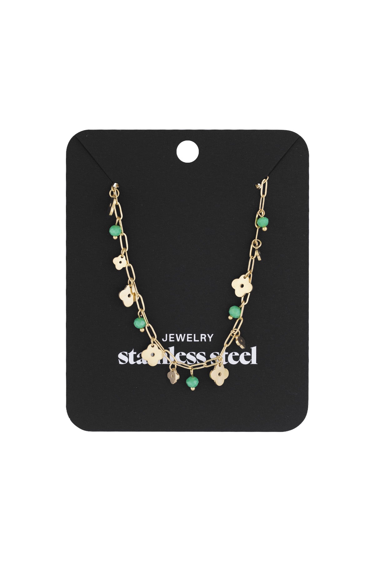 Gold-tone necklace with clover charms and green beads displayed on black stainless steel jewellery card