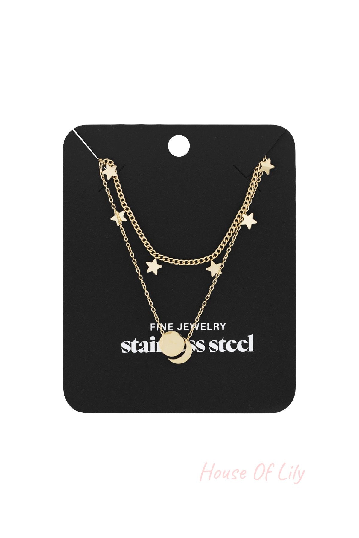 Gold layered star charm necklace with round pendant displayed on black jewelry card with stainless steel label