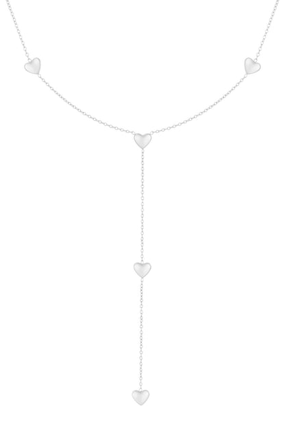 Silver tone delicate heart drop necklace with multiple heart charms and lariat chain design on a white background