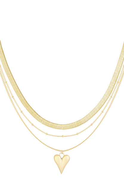 Three-layered gold chain necklace with a heart pendant, showing flat, dotted, and linked chain designs