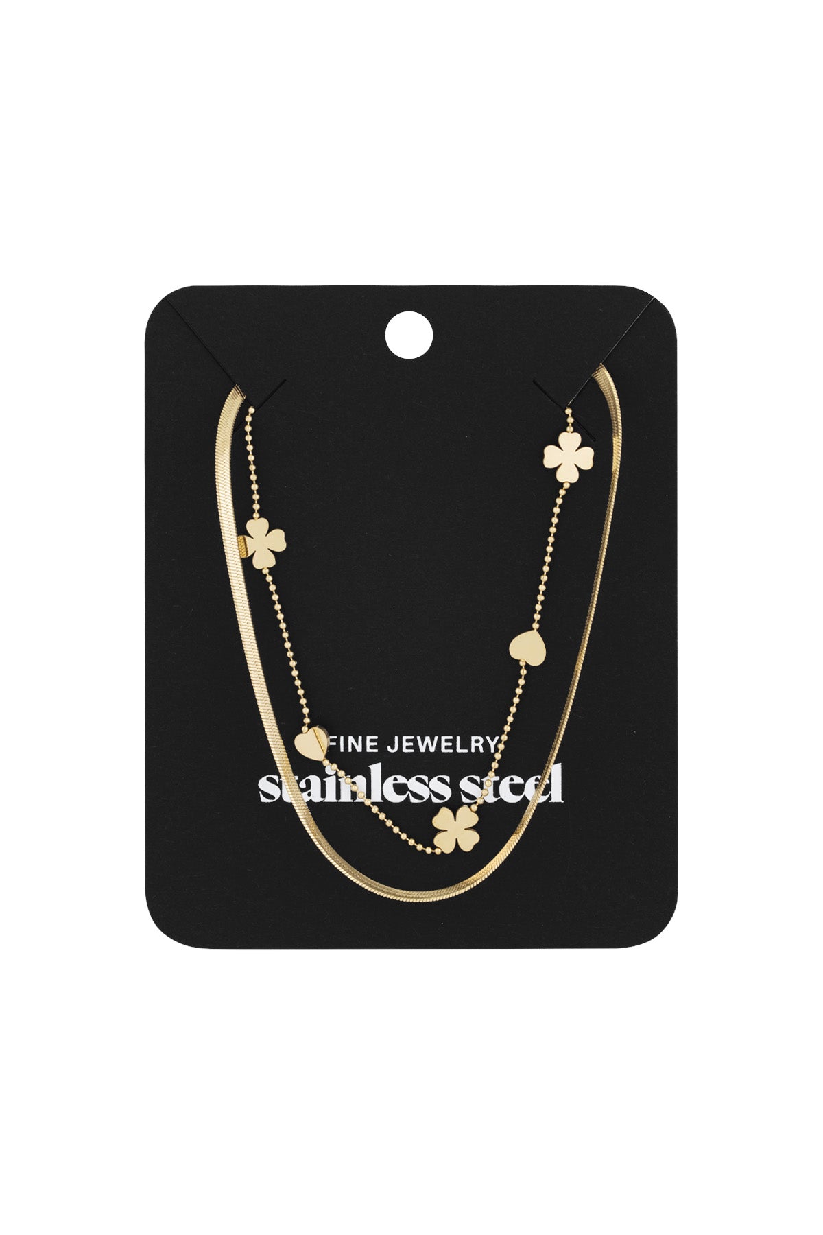 Gold layered necklace with hearts and clovers displayed on black jewelry card labeled stainless steel fine jewelry