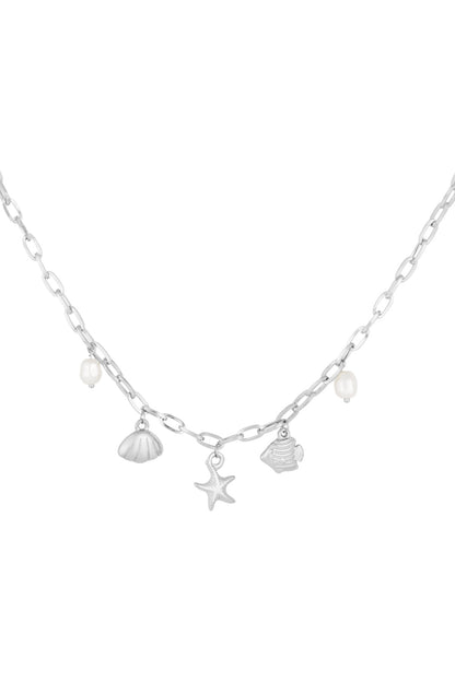 Silver chain necklace with beach-themed charms including starfish, shell, fish, and faux pearls on a white background