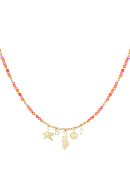 Colorful beaded necklace with gold starfish, shell, pearl, and crystal charms on white background