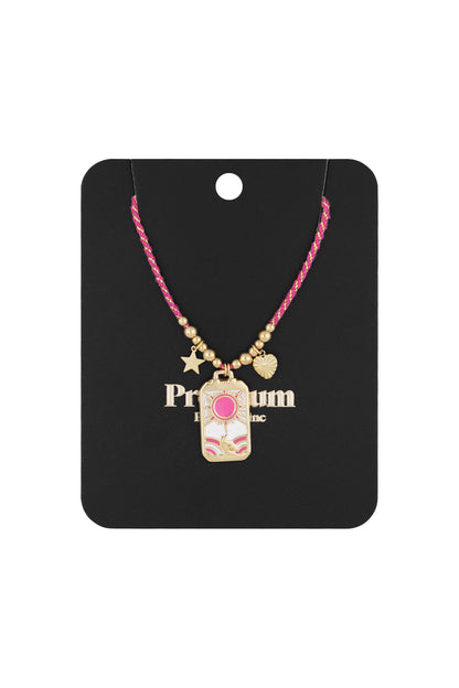 Solar charm necklace displayed on black boutique-style card, showing pink and gold braided cord with gold-tone pendants