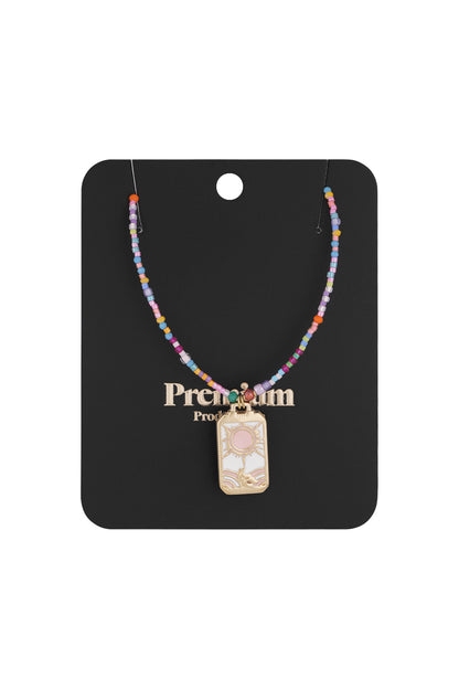 Colorful beaded sun charm necklace displayed on black premium product card