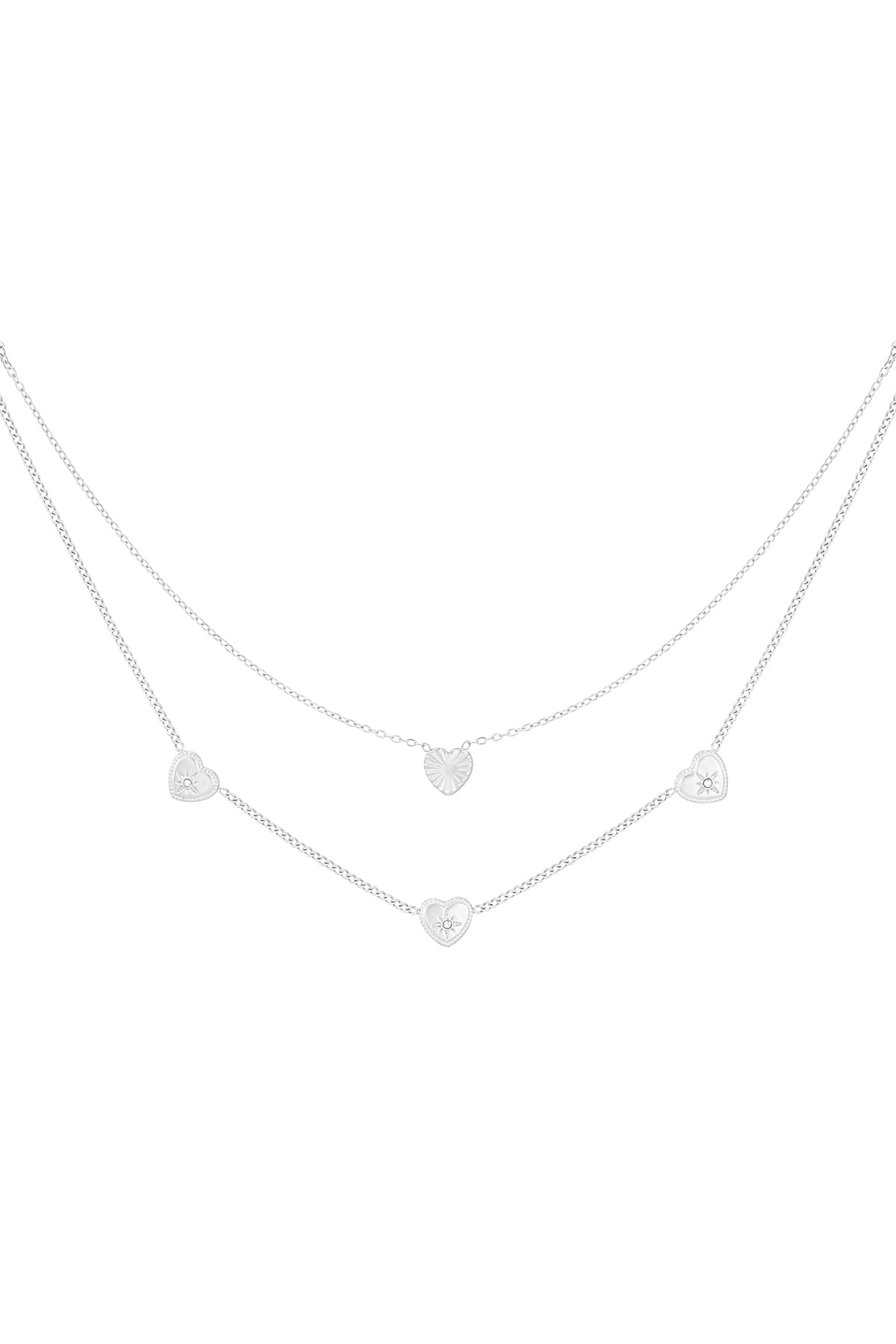 Silver-tone version of the double layered heart necklace with small rhinestone accents on white background