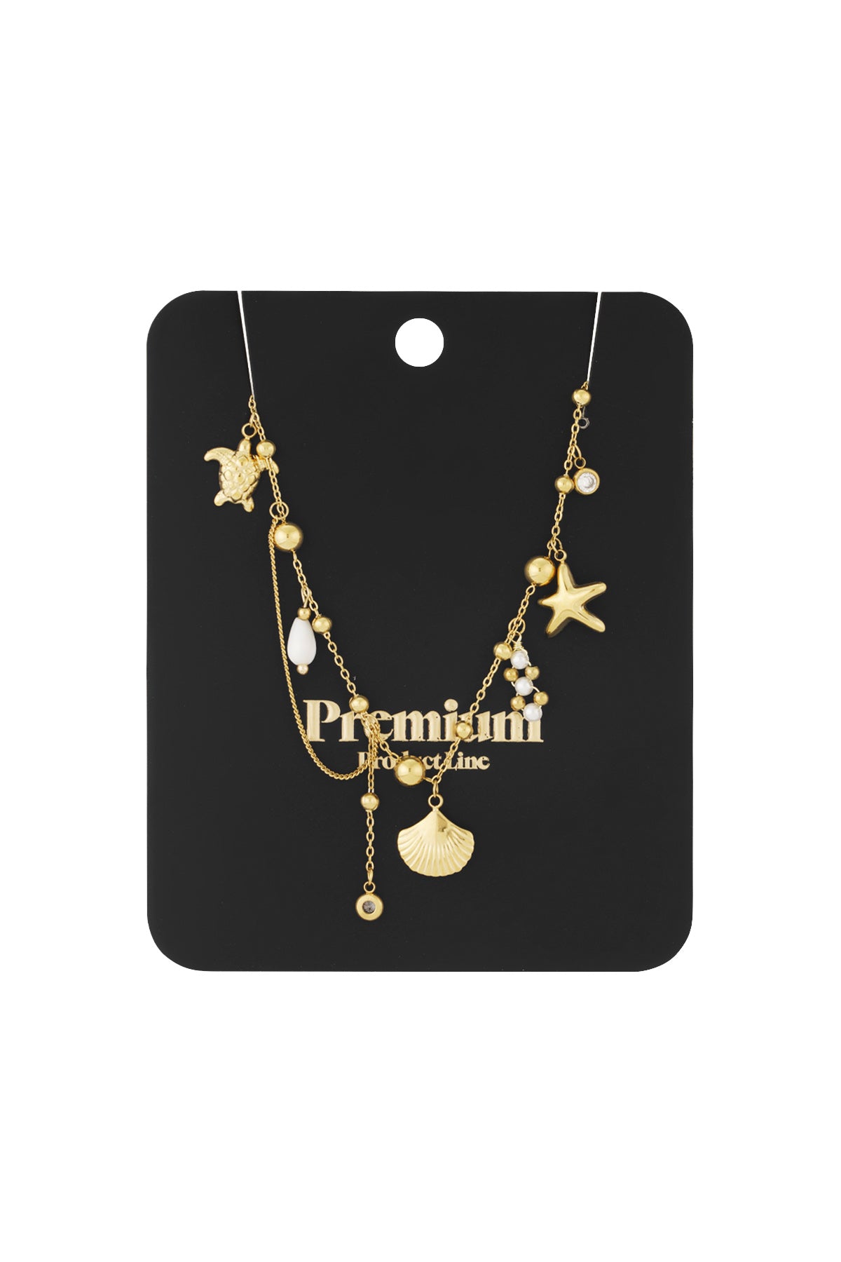 Gold ocean charm pendant necklace displayed on black card packaging reading Premium Product Line
