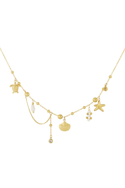 Gold necklace with ocean-themed charms including turtle, starfish, scallop shell, and pearl detail on delicate chain