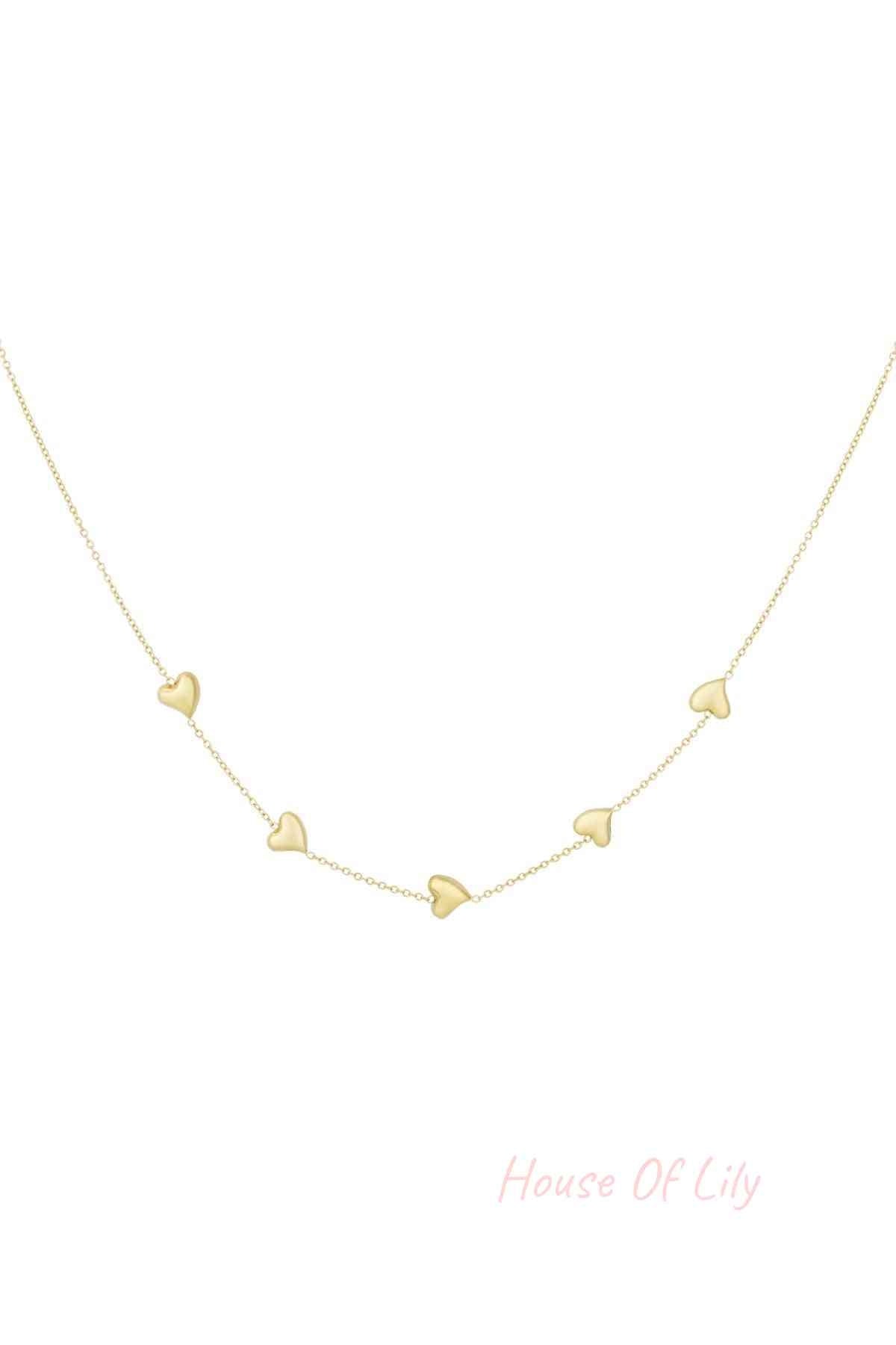 Gold dainty necklace with five small heart-shaped charms evenly spaced on a fine chain, isolated on white background
