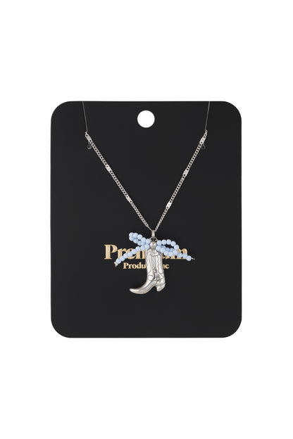 Gold-tone cowboy boot pendant necklace with vibrant pink and orange beaded bow on fine chain