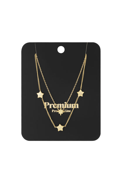 Gold layered star necklace displayed on black premium product card