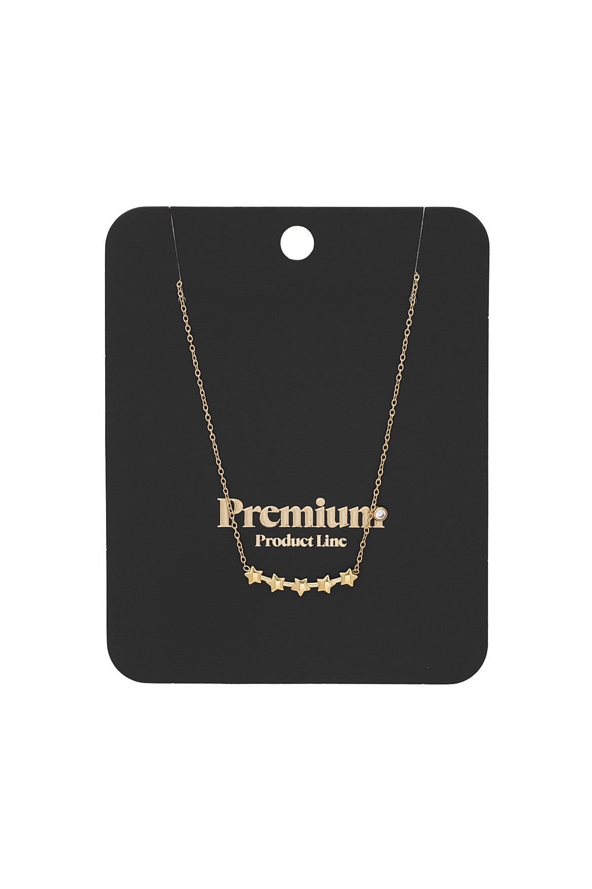 Gold star cluster necklace displayed on black premium product line packaging card