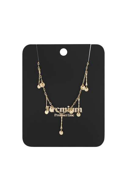 Gold charm necklace displayed on black boutique card packaging with 'Premium Product Line' text