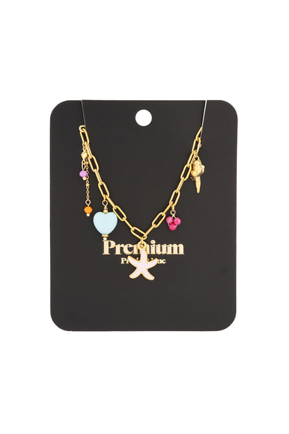 Gold-tone charm necklace displayed on black branded card, featuring starfish and seashell pendants and colourful beads