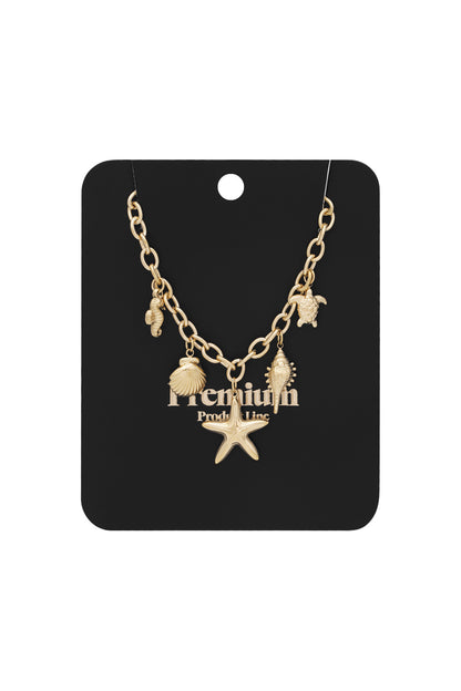 Gold-tone ocean charm necklace displayed on black premium product card