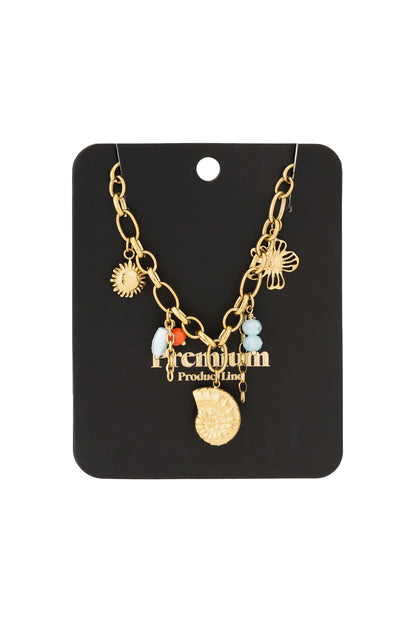 Gold charm link necklace displayed on black boutique-style card