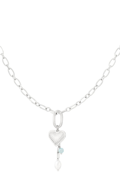 Silver chain necklace with textured heart pendant, aqua bead and pearl shown on white background