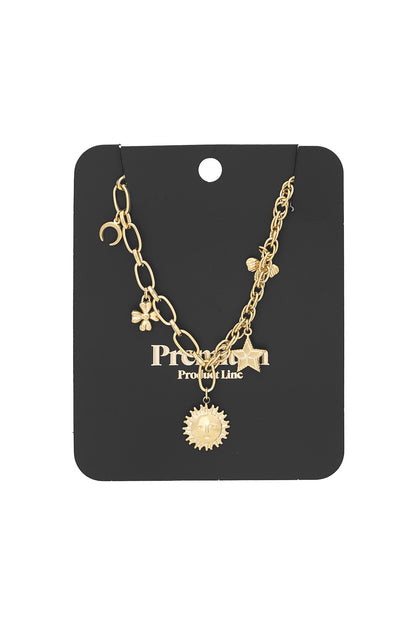 Gold charm necklace displayed on black product card highlighting details of chain and charms