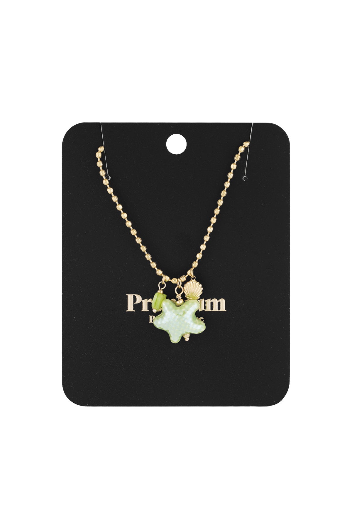 Gold-tone charm necklace displayed on a black 'Premium' branded card with starfish, heart, and seashell charms