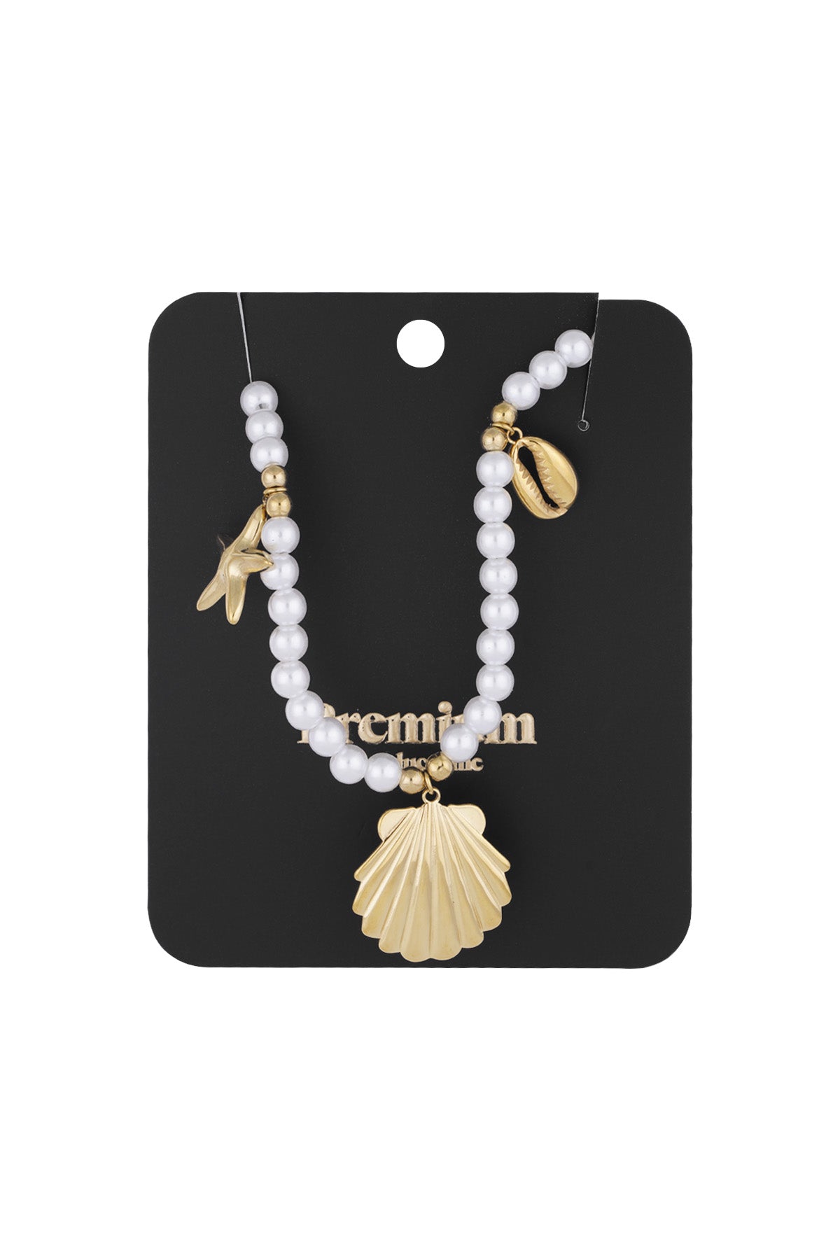 Pearl charm necklace presented on black display card showing detailed sea-inspired gold charms
