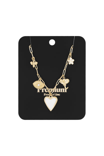 Charm pendant necklace with gold tone charms displayed on black premium product line card