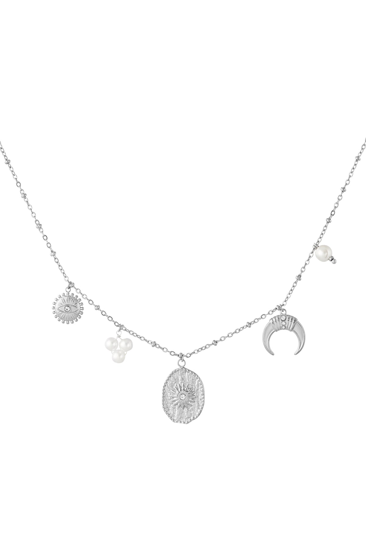 Silver-tone celestial charm pendant necklace displayed on beige curved prop highlighting texture and pearl charms
