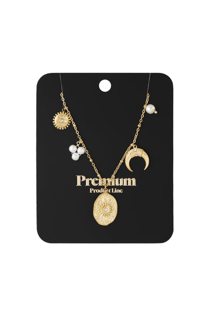 Gold-tone celestial charm necklace displayed on black card packaging labelled Premium Product Line