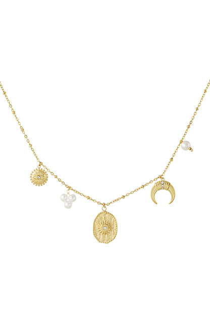 Gold-tone pendant necklace with sun, crescent moon, star charms, and pearl beads on delicate link chain