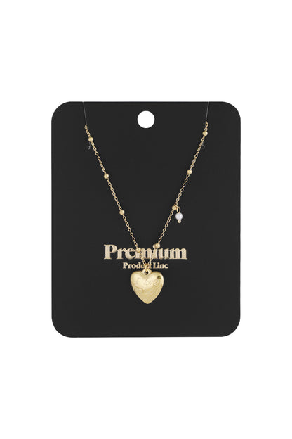 Gold heart charm pendant necklace displayed on black jewellery card with 'Premium' text