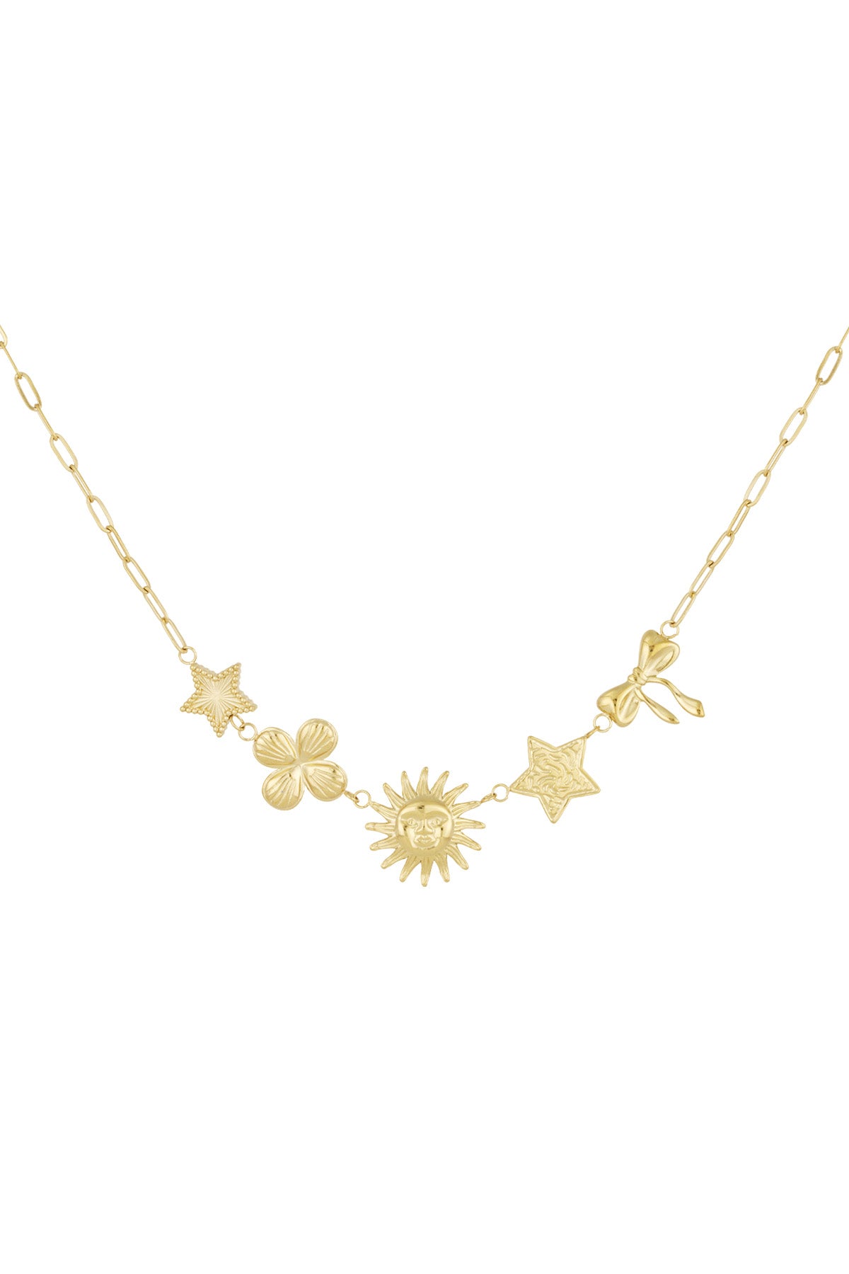 Gold-tone celestial charm necklace with star, clover, sun, textured star, and bow charms laid flat on white background
