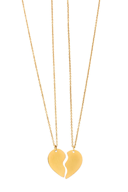 Two gold necklaces with matching half-heart pendants forming a whole heart on white background