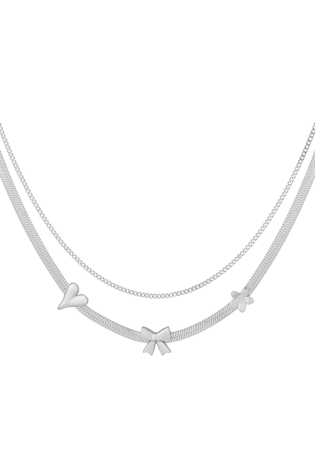 Silver layered charm necklace with heart, bow, and flower pendants on white background