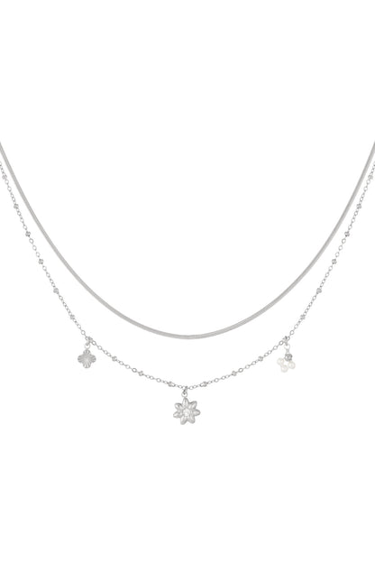 Silver layered necklace displayed on white background showing snake chain and flower pearl charm chain