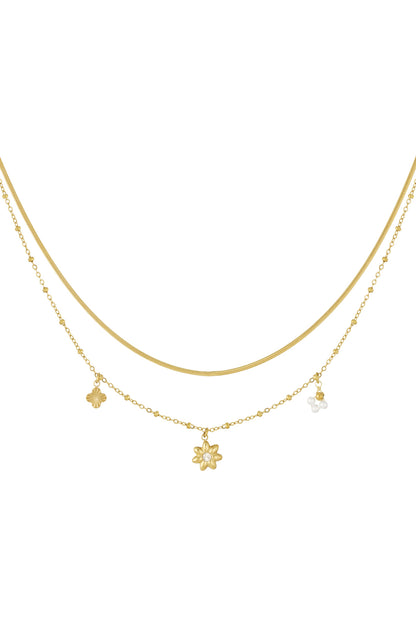 Gold layered flower charm necklace isolated on white background