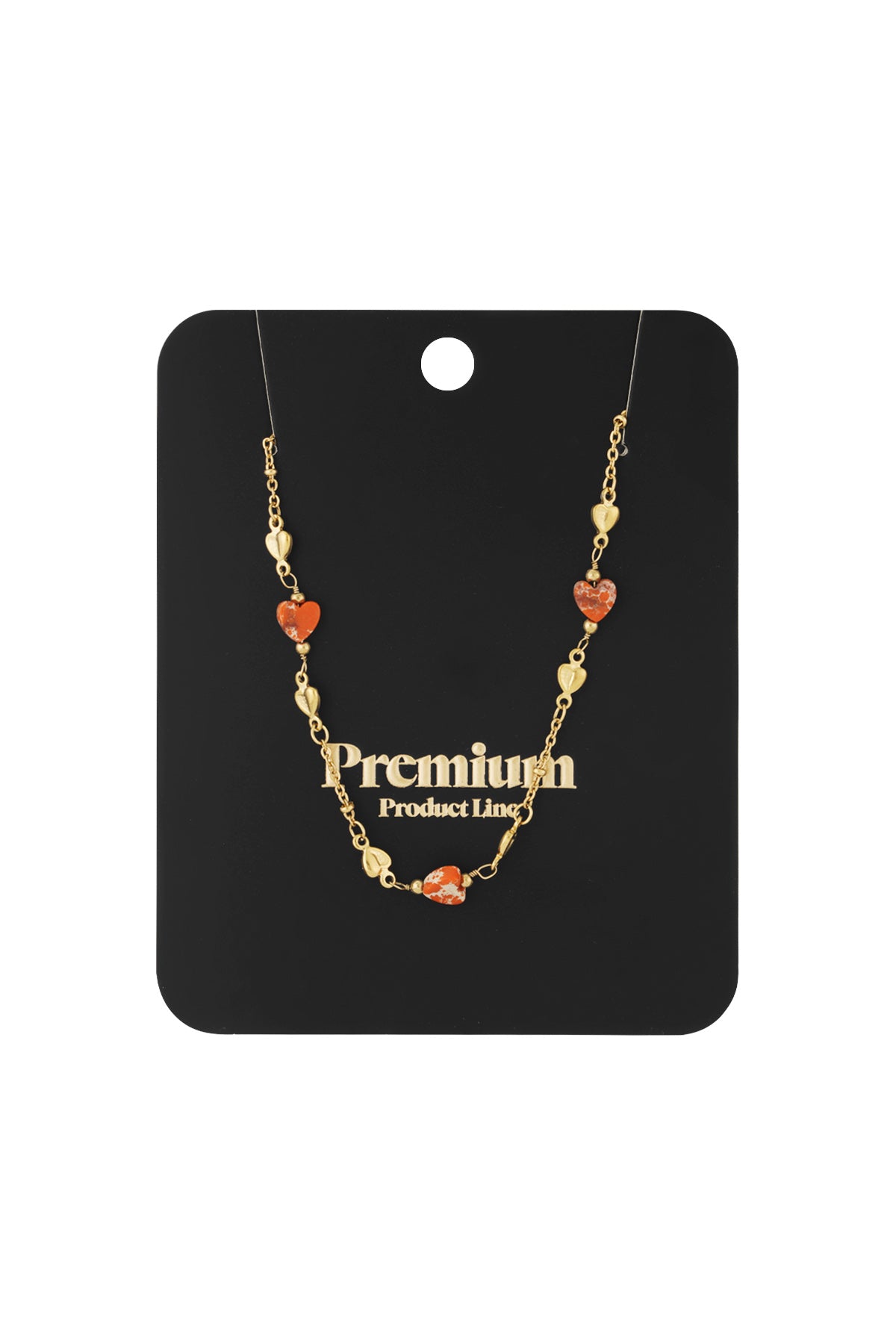 Gold-tone necklace with orange heart-shaped beads displayed on black branded card