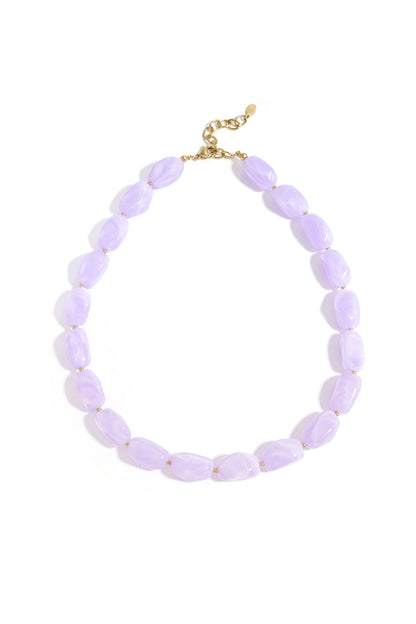 Lavender chunky acrylic beaded necklace with gold accents on white background