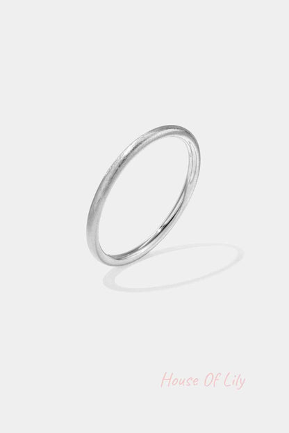 Minimalist silver brushed metal circle bangle isolated on white background