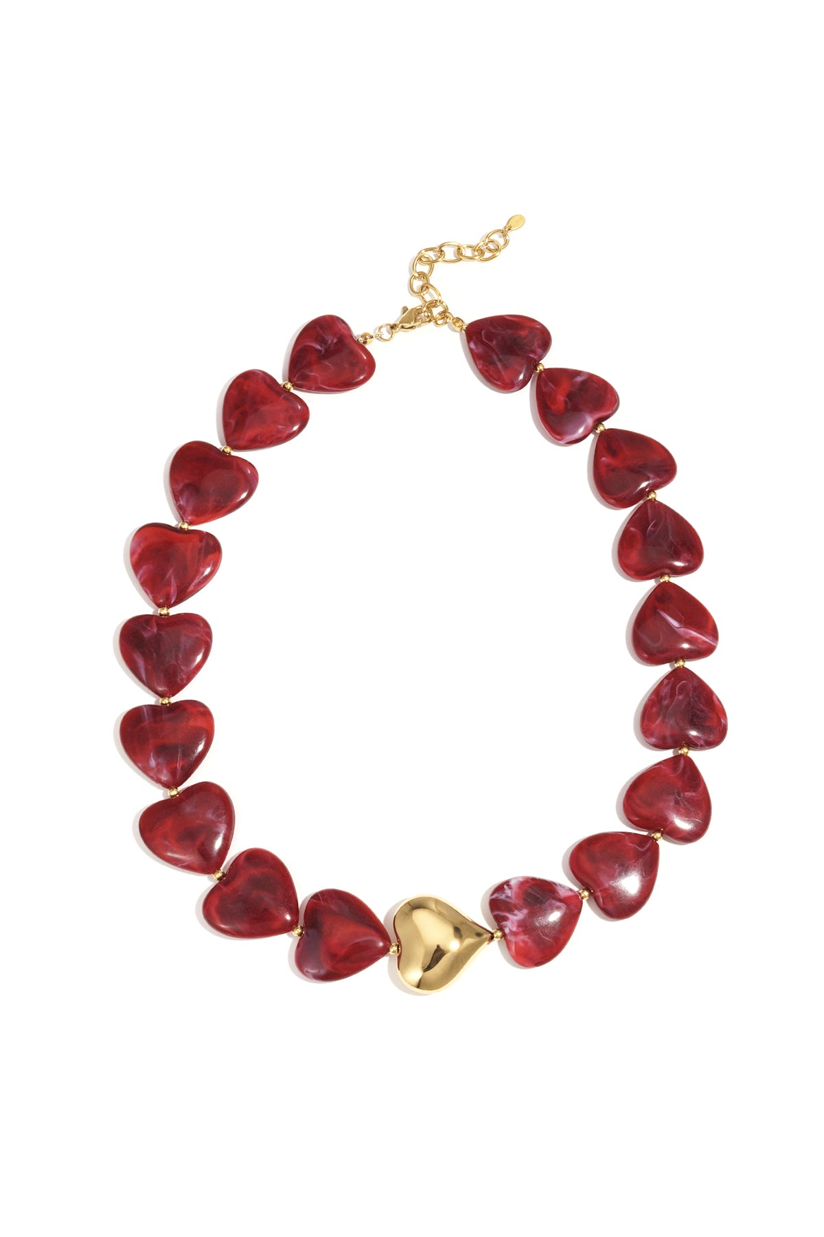 Close-up image of a heart shaped beaded necklace with red marbled acrylic hearts and a central shiny gold heart bead on a white background