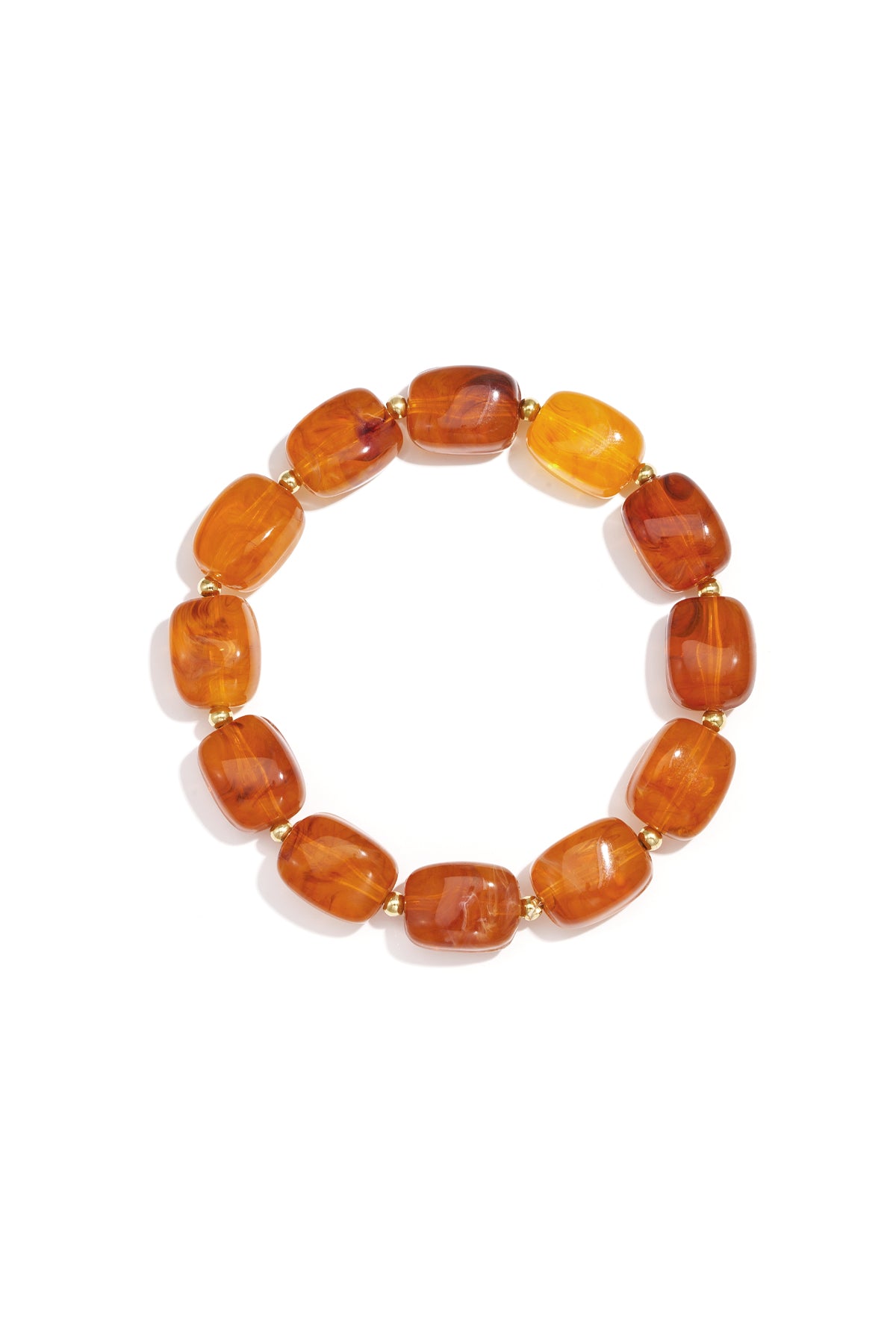 Close-up of amber-colored chunky acrylic beaded bracelet with small gold spacers