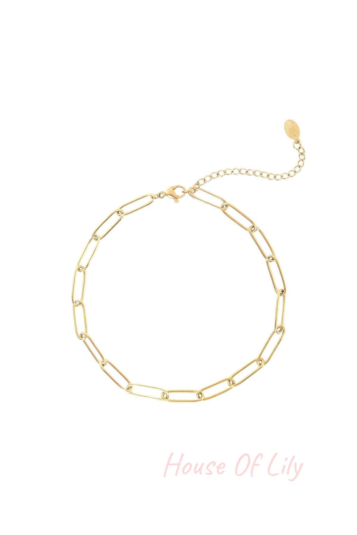 Gold-tone chain link anklet with lobster clasp and extension chain on a white background